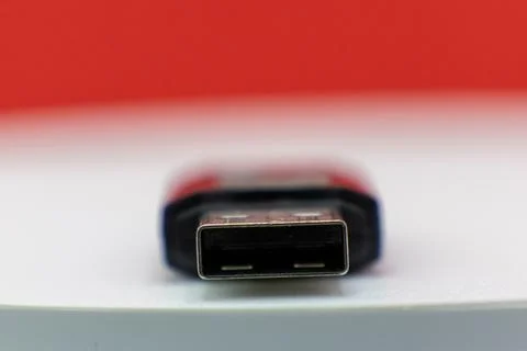 A close-up shot of a USB flash drive, ready to be plugged in for data transfe Foto stock