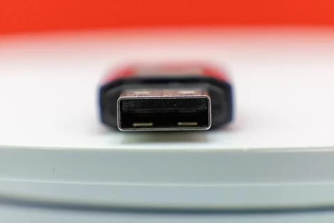 A close-up shot of a USB flash drive, ready to transfer data. Stock Photos