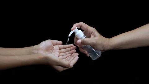 A close up shot is using alcohol antiseptic gel cleaning hand Stock Footage 126883572