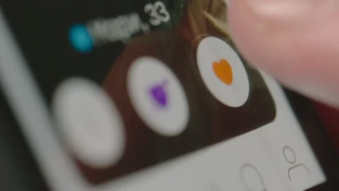 Close shot of Using Badoo app on smartphone 動画素材 134374736