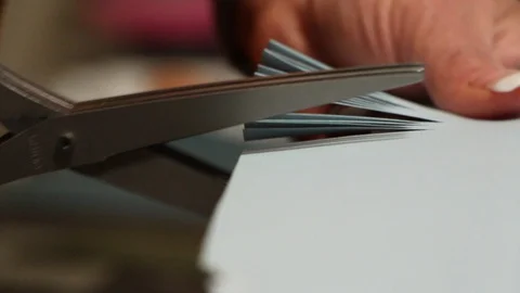 A close shot of using scissor on paper while scrapbook Stock Footage 115213275