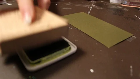 A close shot of using scrapbook ink block Stock Footage 115213270