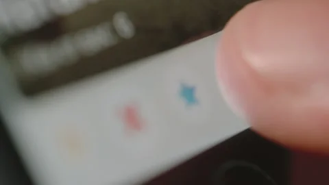 Close shot of using Tinder app on smartphone Stock Footage 134375166