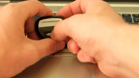 Close up shot using two factor authentication on a laptop for secure logon Stock-Footage 104963506