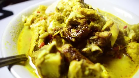 A close-up shot of vegetable rice cake with tofu and Indonesian meat Stock Footage 273166176