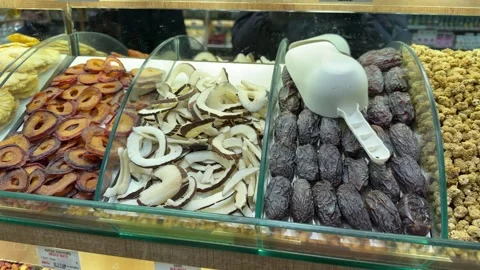 Close-up shot vibrant display of organic dried fruit, coconut chips Stock Footage 340154803