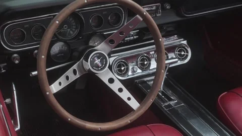 Close-up shot of a vintage car interior with a classic steering wheel Stock Footage 333914676
