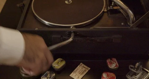 Close-up shot of a vintage gramophone, pulling powering lever Stock Footage 98517225