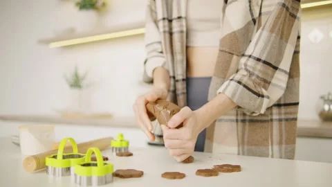 Close up shot, in a warm and inviting kitchen environment, a person is joyfully Stock Footage 289222523