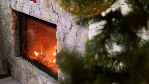 Close-up shot of warm cozy burning fire in a brick fireplace. 4K 動画素材 83377215