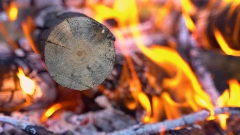 Close-up shot of warm cozy burning fire in a brick fireplace. Slow motion. HD Stock Footage 110810562