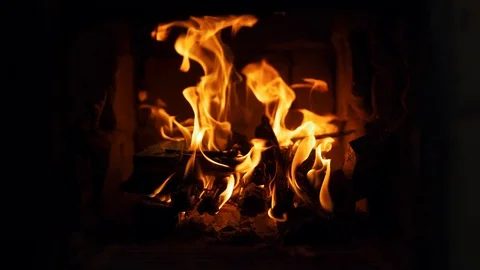 Close-up shot of warm cozy burning fire in a brick fireplace Stock Footage 130167251