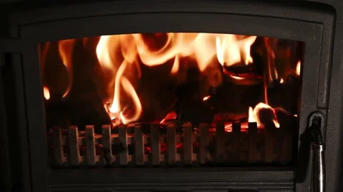 Close-up shot of warm cozy burning fire in a brick fireplace 4k Video stock 140898254