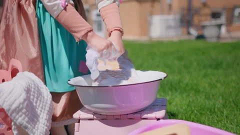 Close up shot of Washing clothes on old vintage washboard outdoors. Young Woman Stock Footage 274509562