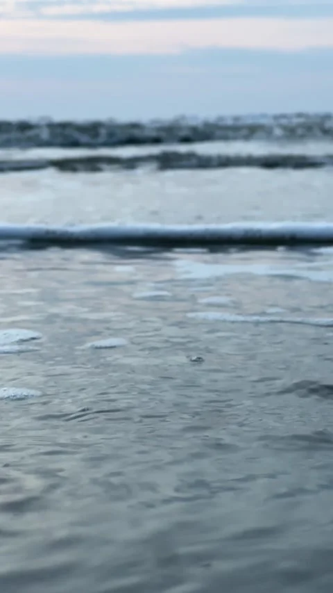 Close up shot of waves coming in to the beach shore Video stock 196927366