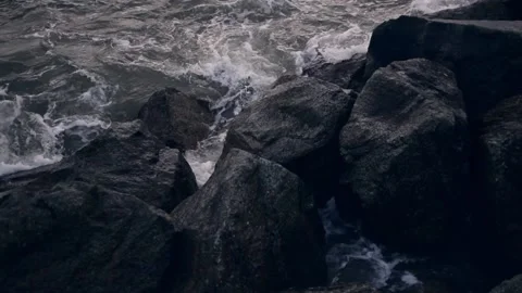 Close up shot of the waves hitting the rocks Stock Footage 143387585