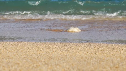 Close Up Shot of Waves Rolling Up White Sand Beach Video stock 124630369