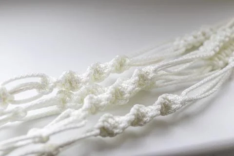 Close up shot weaved macrame flowerpot. Craft Stock Photos