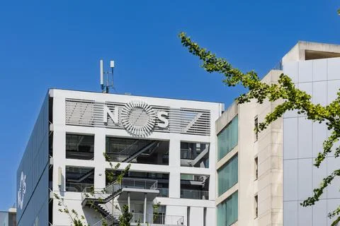 A close-up shot of the white, grid-like facade of a modern building with the Stock Photos