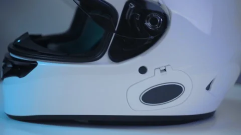 Close up shot on white motorcycle full-face helmet. Video stock 107969777
