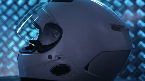 Close up shot on white motorcycle full-face helmet on metal bacground. Stock Footage 108010108