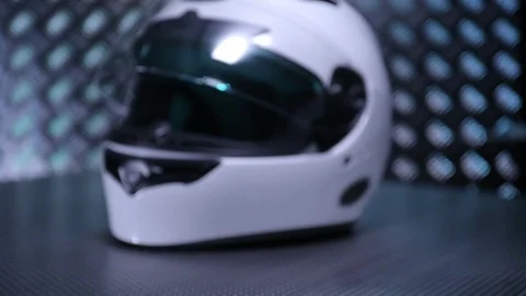 Close up shot on white motorcycle full-face helmet on metal bacground. Video stock 108065082