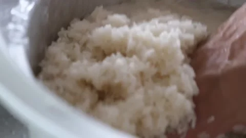 Close-up Shot of White Rice Being Handled in a Cooking Pot Stock Footage 338211752