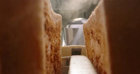 Close up shot of white sliced bread popping out of toaster with water steaming Vídeos de archivo 156298844