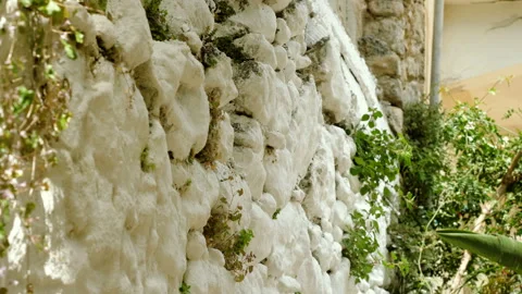 Close-up shot of the white stone wall in Greece. 4K Stock Footage 114609548