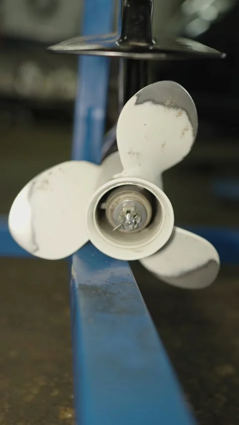 A close-up shot of a white three-blade aluminum propeller Stock Footage 340817925