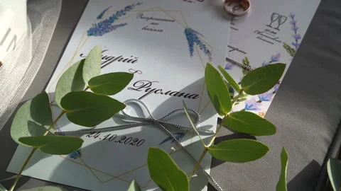 Close shot of white wedding invitations. Amazing details. Sunshine and Stock Footage 148736870