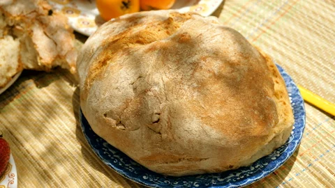 Close-up shot of white wheat bread on a plate prepared for a picnic outdoors. 4K Video stock 116614664