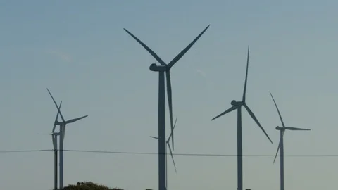 Close shot of wind turbines generating power, in slow motion 库存影片 98015300