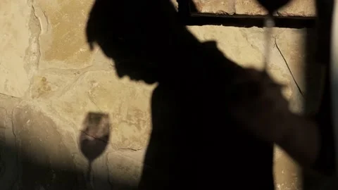 Close up shot winemaker or sommelier is pouring red wine in transparent glass Stock Footage 238539480
