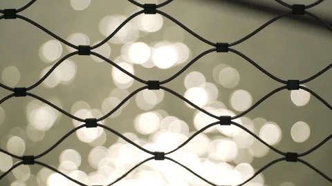 Close up shot of a wire grid with a river in the background, Paris, France Stock Footage 104145713