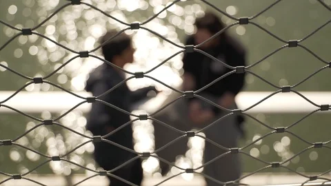 Close up shot of a wire grid with a river in the background, Paris, France Stock Footage 104145938