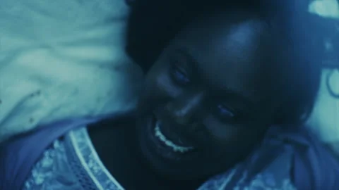 Close-up shot of woman crying while possessed by devil on her bed - Reenactment 스톡 동영상 202896484
