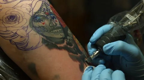 Close up Shot of Woman's Arm Getting Tattooed Stock Footage 54477773