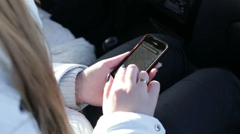 Close-up shot of a woman's hand , looking navigation on your smartphone Stock Footage 61545287