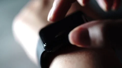 Close up shot of woman's hand testing a new purchase - smart watches. Stock Footage 73394458