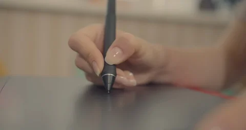 Close up shot . Womans hand using graphic pen and tab , working time for some gr Stock Footage 117476315