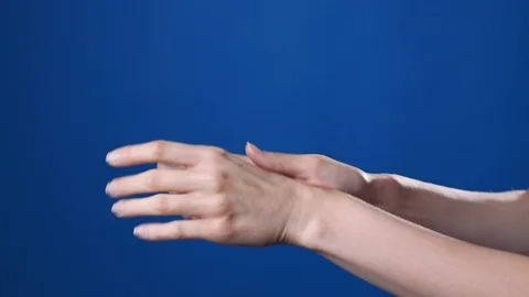 Close up shot of the woman's hands are applying hand's cream, skin care, spa for Stock Footage 102086407