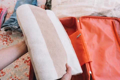 Close-up shot of a woman's hands preparing the beach equipment for her summer Stock Photos