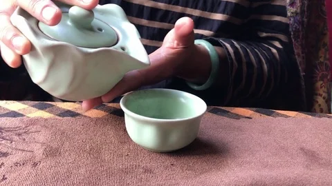Close Up Shot of Woman's Hand's Serving Tea Video stock 105189939