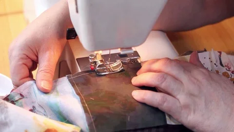 Close-up shot. Woman's hands is stitching by sewing machine part of patchwork Stock Footage 105526104