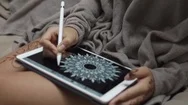 Close Up Shot Of A Womans Hands, Who Draws A Flower On A Portable Tablet Stock Footage