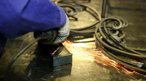 Close up shot worker with grinder grinds metall with sparks Stock Footage 67093200