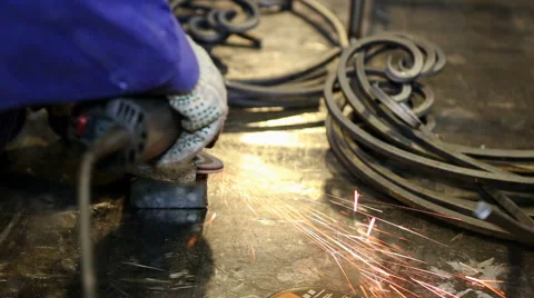 Close up shot worker with grinder grinds metall with sparks Stock Footage 67093226