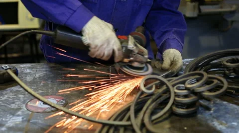 Close up shot worker with grinder grinds metall with sparks Stock Footage 67093286