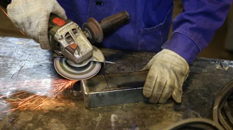 Close up shot worker with grinder grinds metall with sparks Stock Footage 67093563